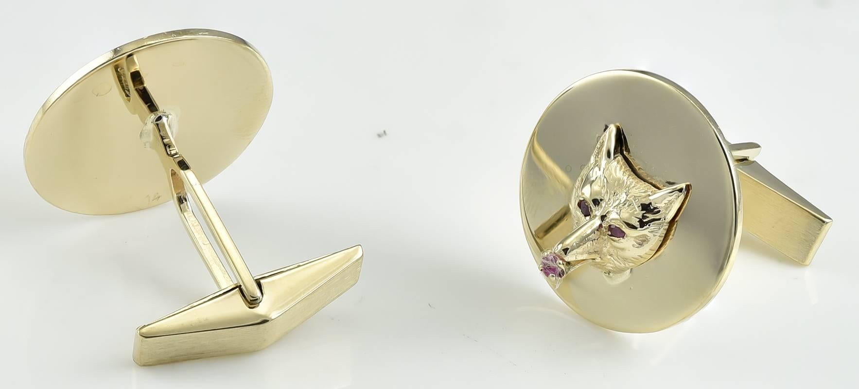 Handsome figural fox head cufflinks.  14K yellow gold, with three-dimensional fox heads, set with faceted rubies.    3/4