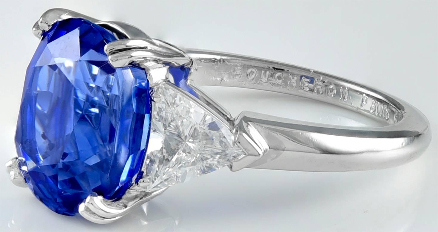 Glorious Ceylon sapphire and diamond ring.  Made, signed by BOUCHERON PARIS.  The center stone is a beautiful and strongly saturated natural unheated Ceylon sapphire of approximately 6.15 carats.  Set with two modified triangular brilliant-cut