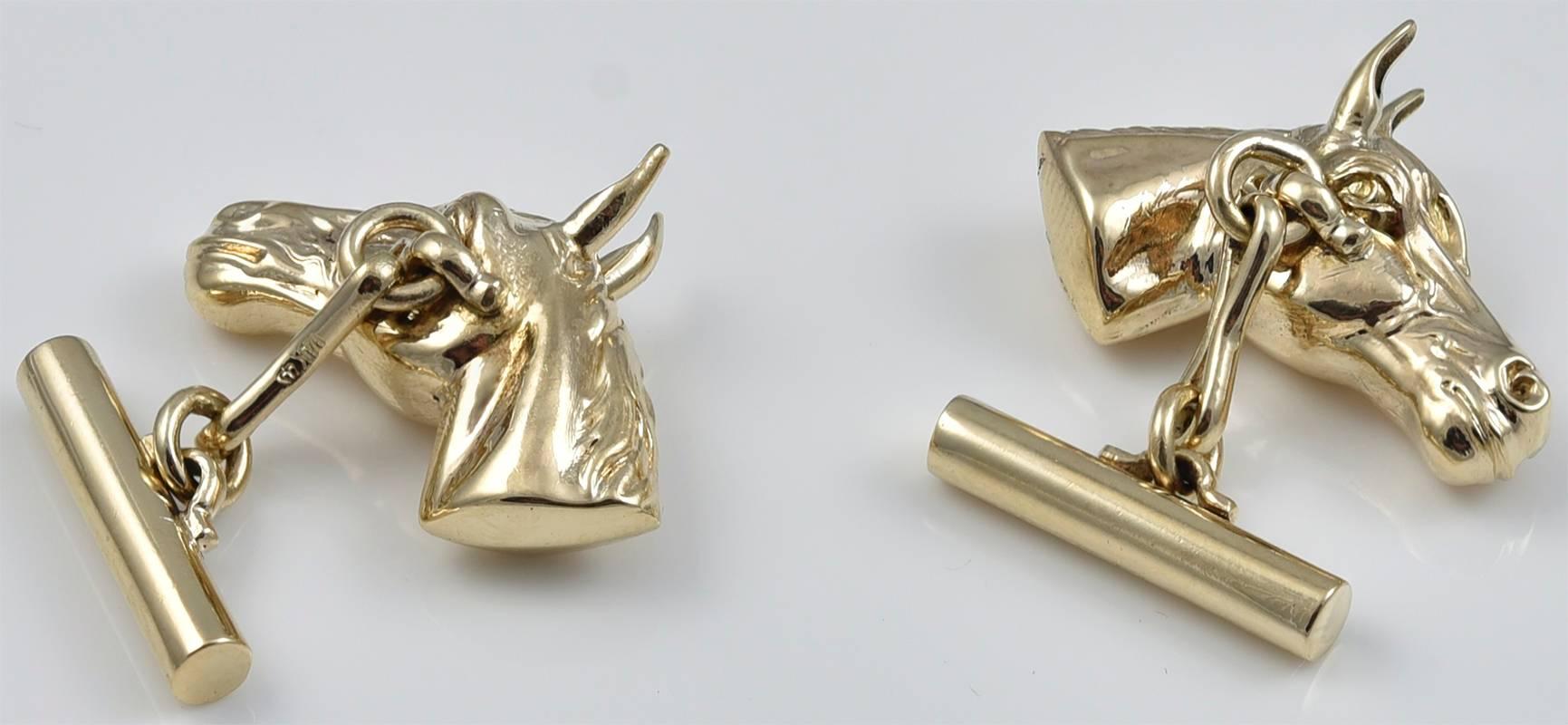 Realistic figural horse head cufflinks.  Well-rendered, with perky ears. Cabochon ruby eyes.  1
