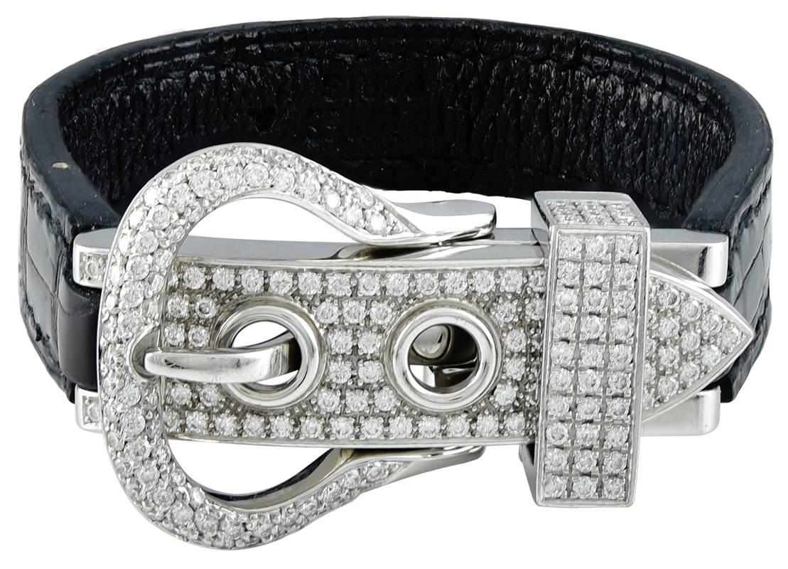 Very rare diamond buckle bracelet.  Made, signed and numbered by HERMES. 18K white gold, encrusted with over 2 carats of brilliant diamonds.  With two Porsus  crocodile straps, black and brown.  Excellent condition.  Overall length is 7 1/4.