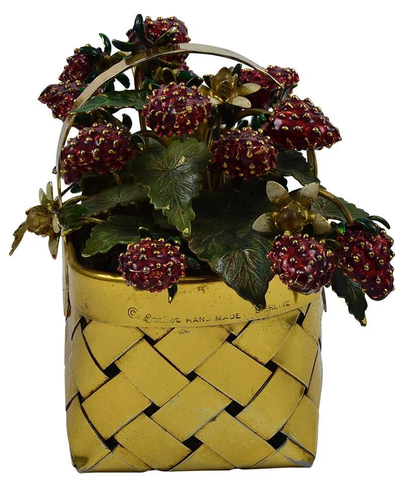 Beautiful figural basket overflowing with ripe strawberries.  Made and signed by CARTIER.  Hand made sterling silver, with a rich vermeil finish.  Red enamel strawberries, with green leaves and a few white blossoms.  4 1/2