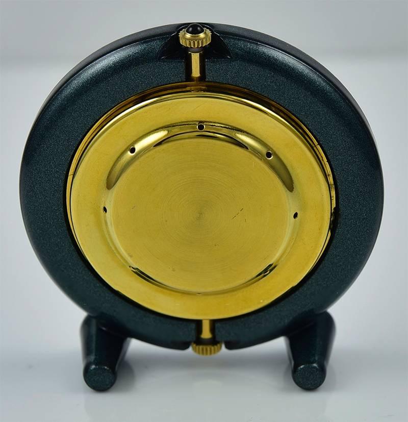 Elegant miniature clock, with two ball feet.  Made by VERDURA.  Luminous deep green enamel on brass.  Classic face with Roman numerals.  2