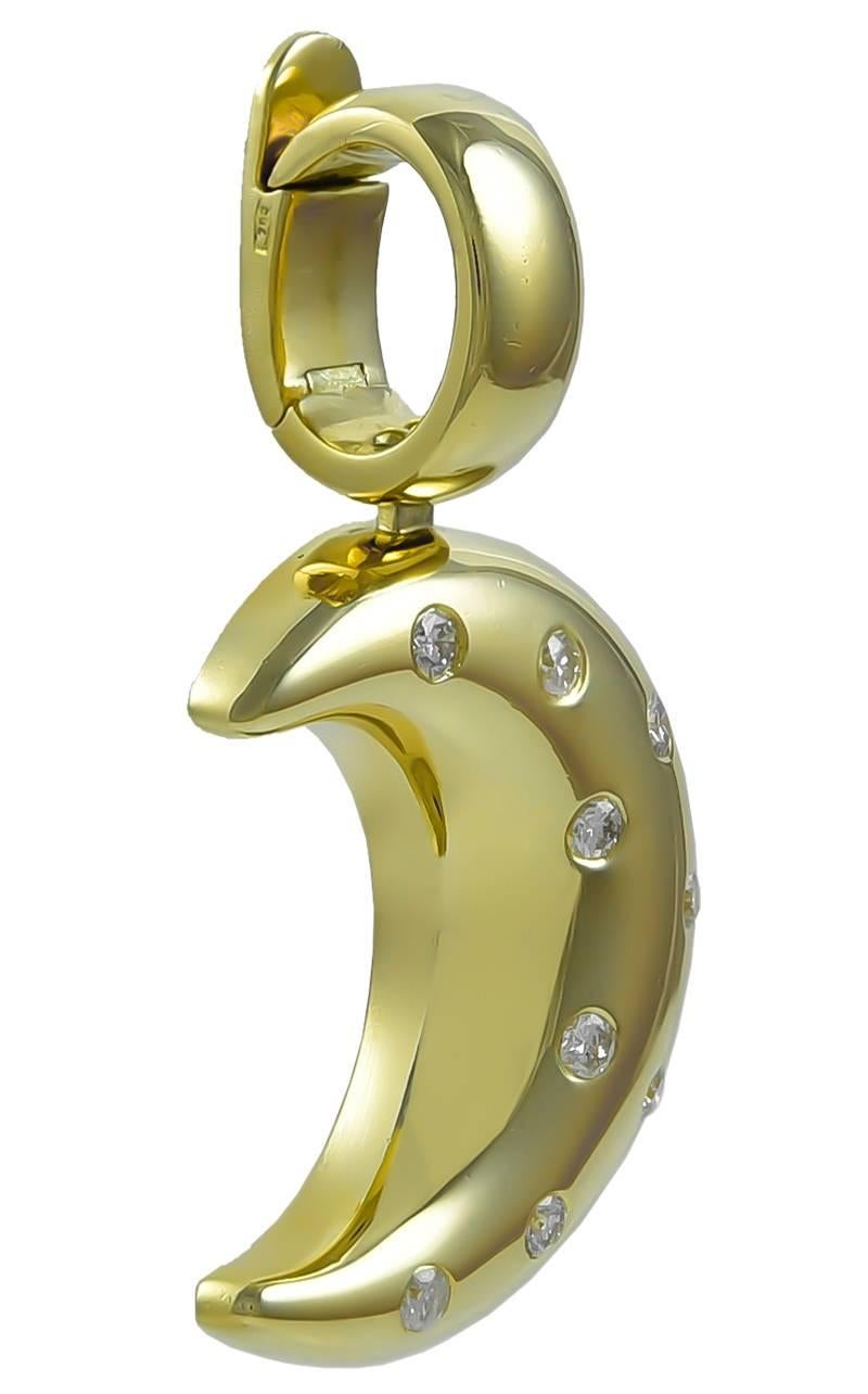 Luminous figural moon pendant.  Very heavy gauge 18K yellow gold, set with nine sparkling faceted diamonds.  2 1/2