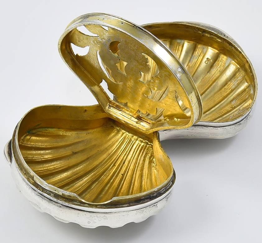 Beautiful shell-shaped hinged vinaigrette.  Made and signed by GUCCI.  Sterling silver with impeccable cut-out gilt interior.  ! 1/4