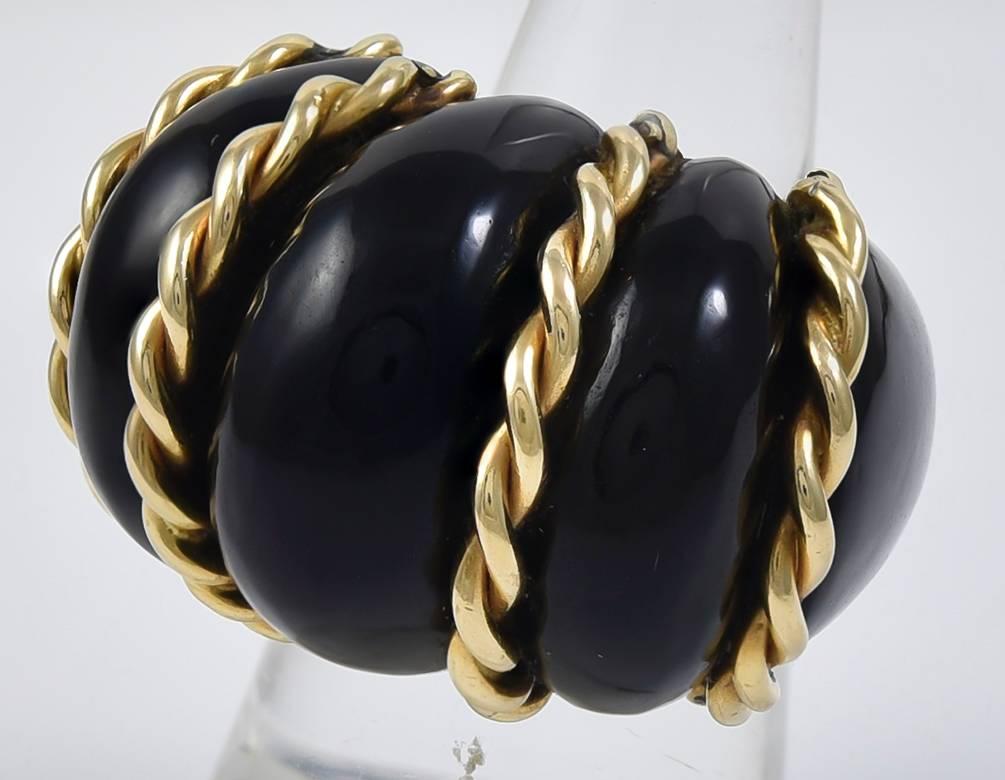 Big and bold cocktail ring.  Polished onyx, set with 14K yellow gold rope pattern applique.  Size 6 3/4.  A striking statement.

Alice Kwartler has sold the finest antique gold and diamond jewelry and silver for over forty years.