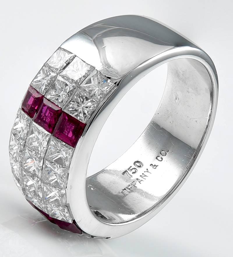Gorgeous wide band.  Made and signed by TIFFANY & CO.  Set with 2.02 cts. of dazzling white diamonds and .61 cts. of brilliant French-cut rubies.  18K white gold.   5/8