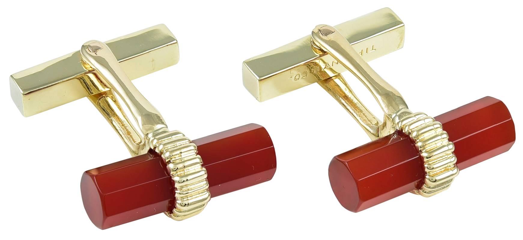 Classic bar cufflinks.  Made and signed by TIFFANY & CO.  Faceted carnelian bars, intersected with ribbed gold bands.  14K yellow gold.  Very handsome.

Alice Kwartler has sold the finest antique gold and diamond jewelry and silver for over