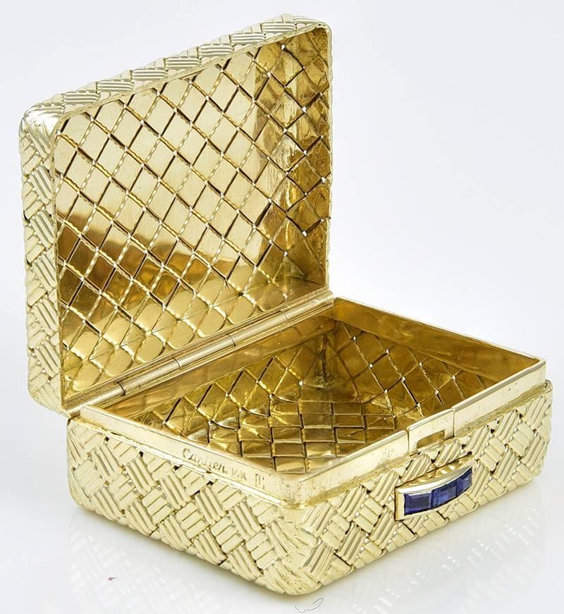 Perfectly designed basketweave gold pill box.  Made and signed by CARTIER.  
1 1/4