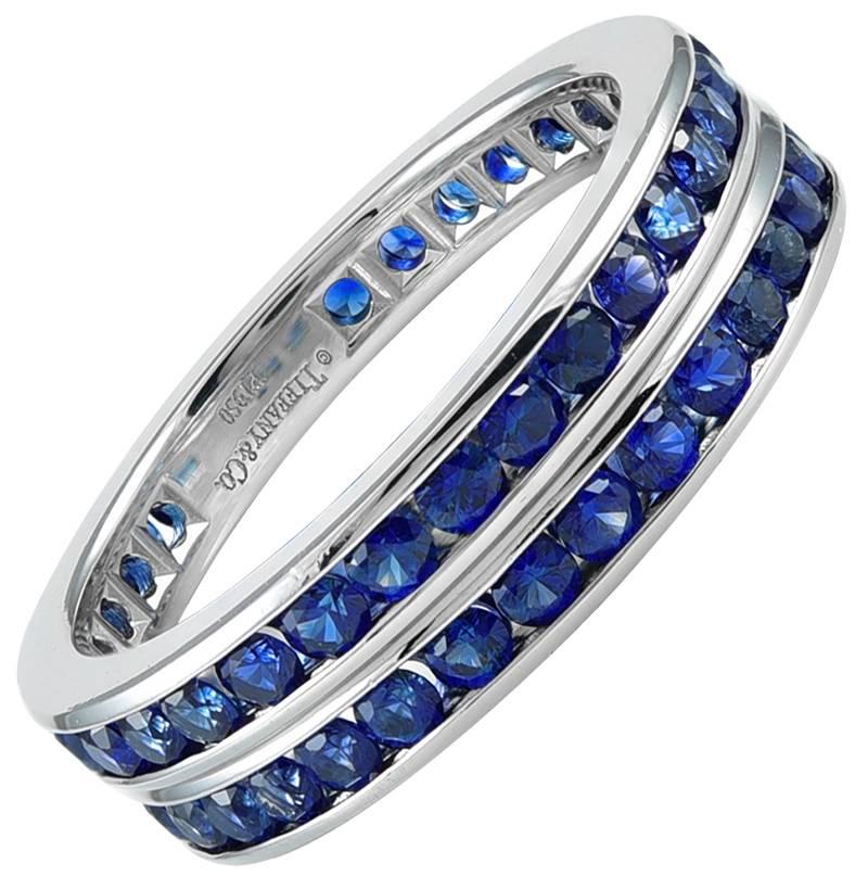 Absolutely beautiful pair of eternity bands.  Made and signed by TIFFANY & CO.  Round brilliant cut sapphires, true blue color, perfectly matched.  Set in platinum.  Size 9.  Outstanding.

Alice Kwartler has sold the finest antique gold and