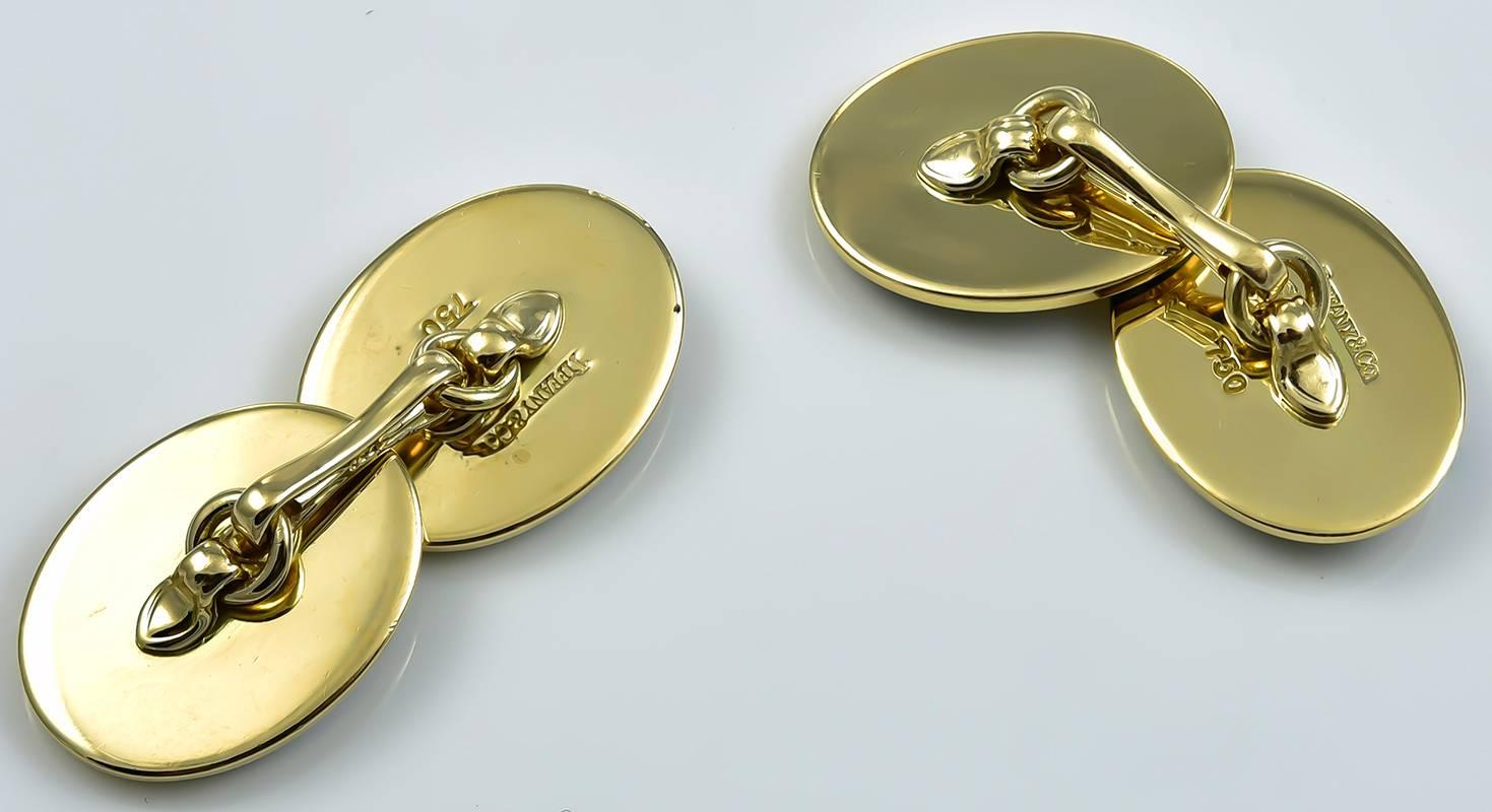 Outstanding double-sided cufflinks.  Made and signed by TIFFANY & CO.  Very heavy gauge 18K yellow gold, bordered with a wide deep green enamel stripe.  Large size.  Look and feel beautiful.  These are exceptional.

Alice Kwartler has sold the
