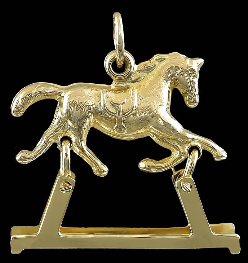 Great mechanical charm:  a figural "rocking horse" that is articulated and actually rocks back and forth.  14K yellow gold.  3/4" x 2/3"  A beautiful representation of a prancing horse.

Alice Kwartler has sold the finest antique