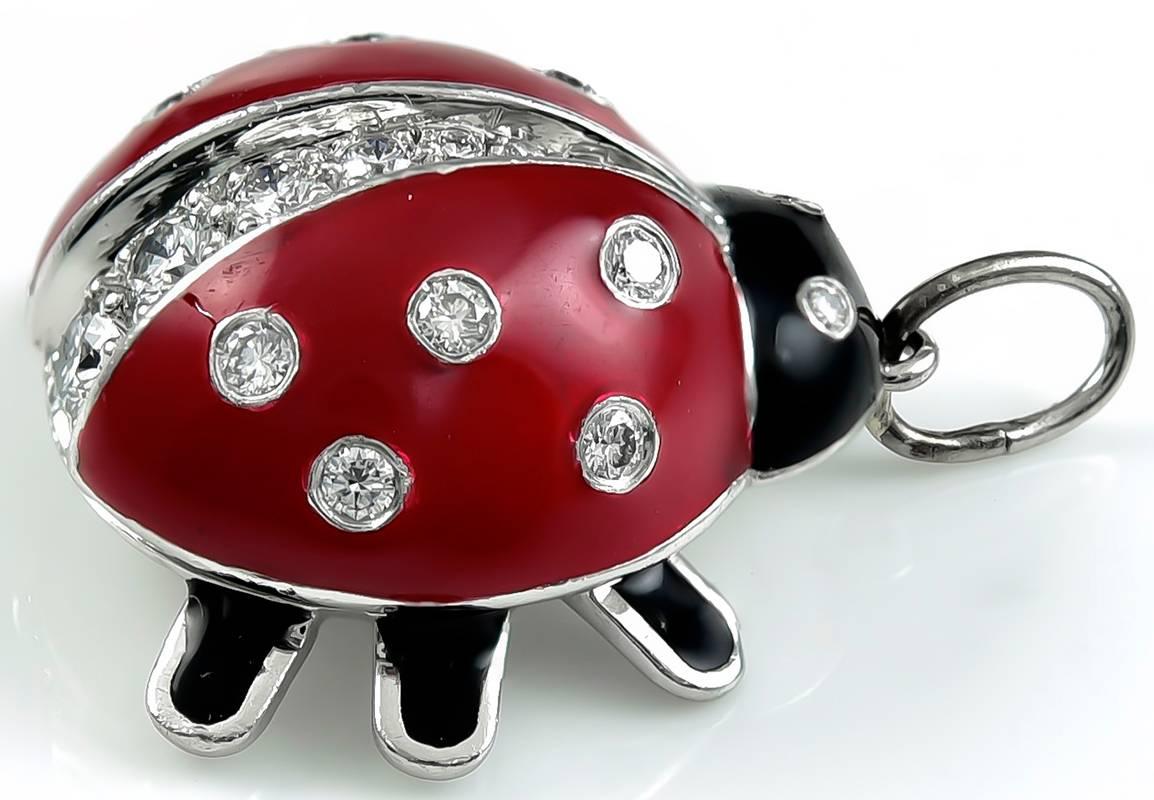 Charming charm:  a platinum figural "Ladybug."  Made and signed by TIFFANY & CO.  Red and black enamel, encrusted with diamonds.  1/2" x 3/4."  This charm has been retired and is no longer available at Tiffany &
