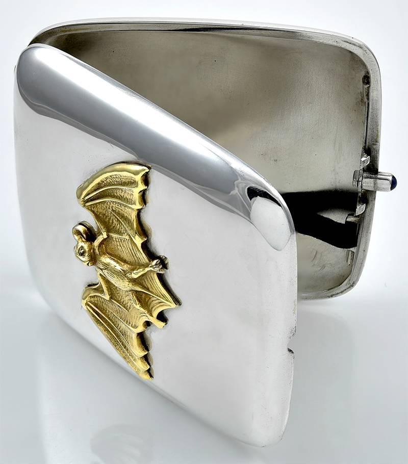 Fabulous hinged sterling silver case, with an applied gilt brass figural 