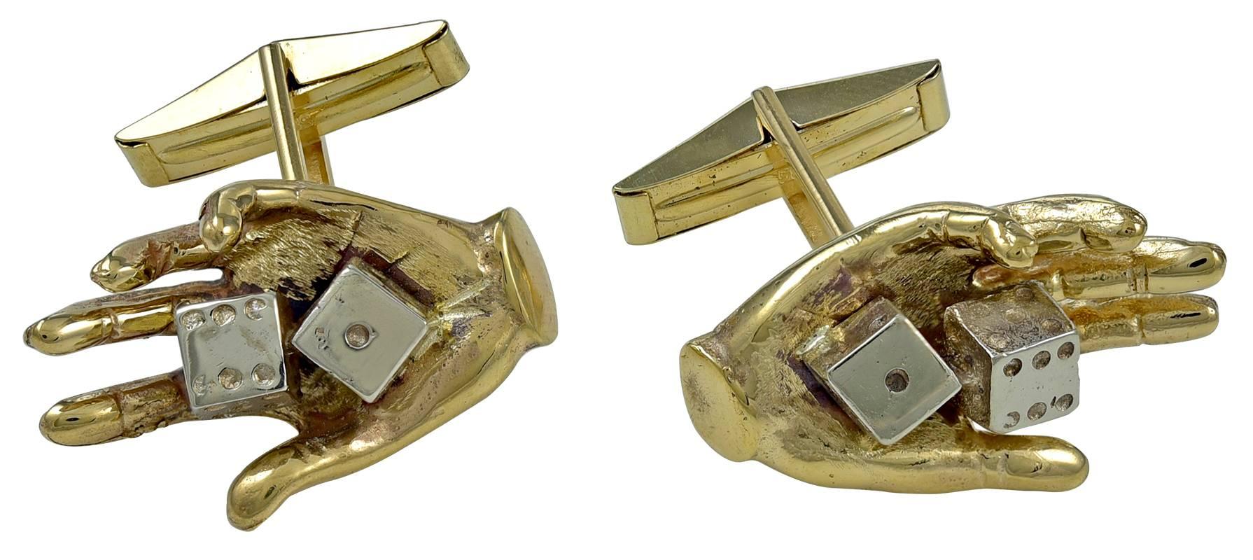 Fun figural Lucky 7 "dice in hand" gambling cufflinks.  14K yellow gold.  T-bar backs for easy closure.  1" x 1/2."  

Alice Kwartler has sold the finest antique gold and diamond jewelry and silver for over forty years.