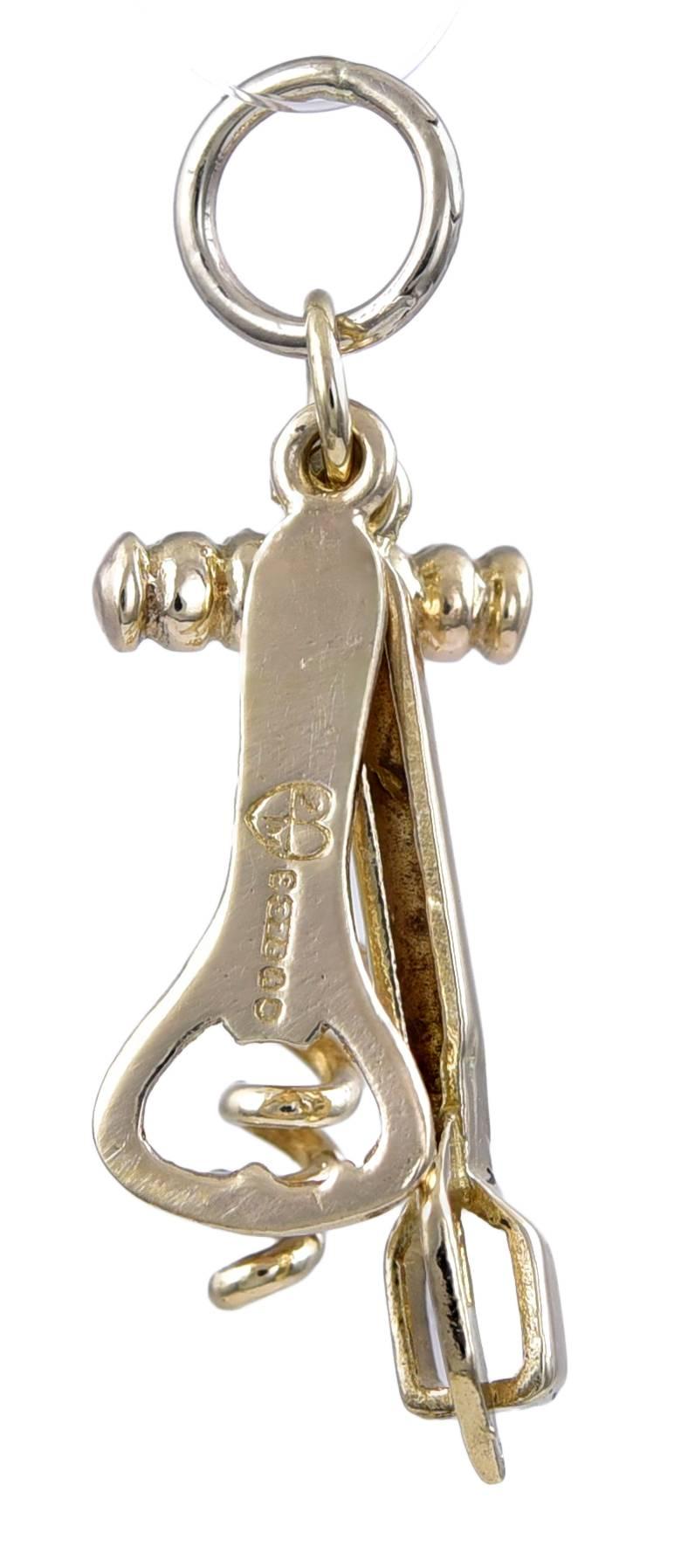 Unique charm:  figural corkscrew, ice tongs and bottle opener. 14K yellow gold. Cheers!

Alice Kwartler has sold the finest antique gold and diamond jewelry and silver for over forty years.