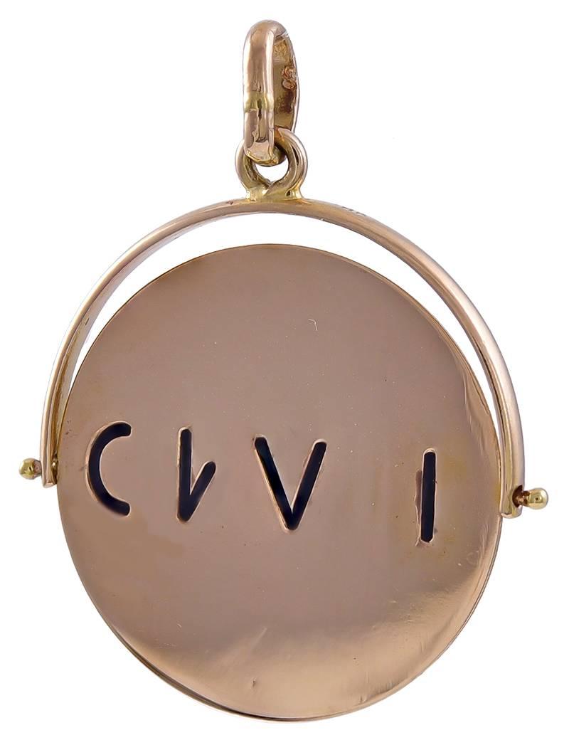Great spinner charm.  18K yellow gold, spelling out "TI-AMO" --  "I LOVE YOU" in  Italian.  18K yellow gold, with black enamel lettering.  1" in diameter.

Alice Kwartler has sold the finest antique gold and diamond jewelry