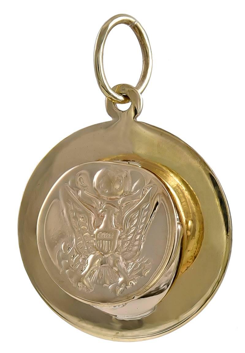 Figural United States Army "Soldier's Cover" charm/pendant.  Raised applied logo on top of hat and on brim.  14K yellow gold.  3/4" in diameter.

Alice Kwartler has sold the finest antique gold and diamond jewelry and silver for over