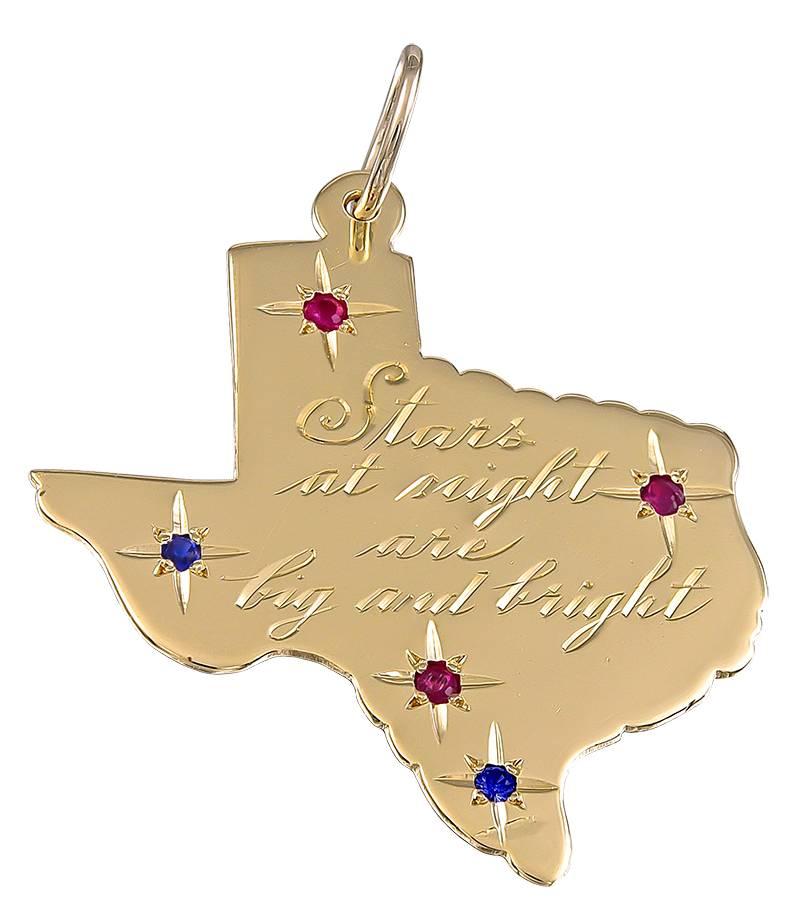 Great large "State of Texas" figural charm.  14K yellow gold, set with faceted rubies and sapphires.  Engraved on front:  "Stars at night are big and bright." The reverse side is engraved:  "Y'ALL COME BACK."  1