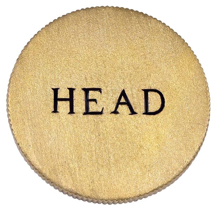 Excellent "Head or Tail" coin.  Very solid heavy gauge 14k yellow textured gold, with crisp black enamel lettering.  1 1/3" in diameter.  Deeply grooved coin-cut border.  Outstanding.

Alice Kwartler has sold the finest antique gold