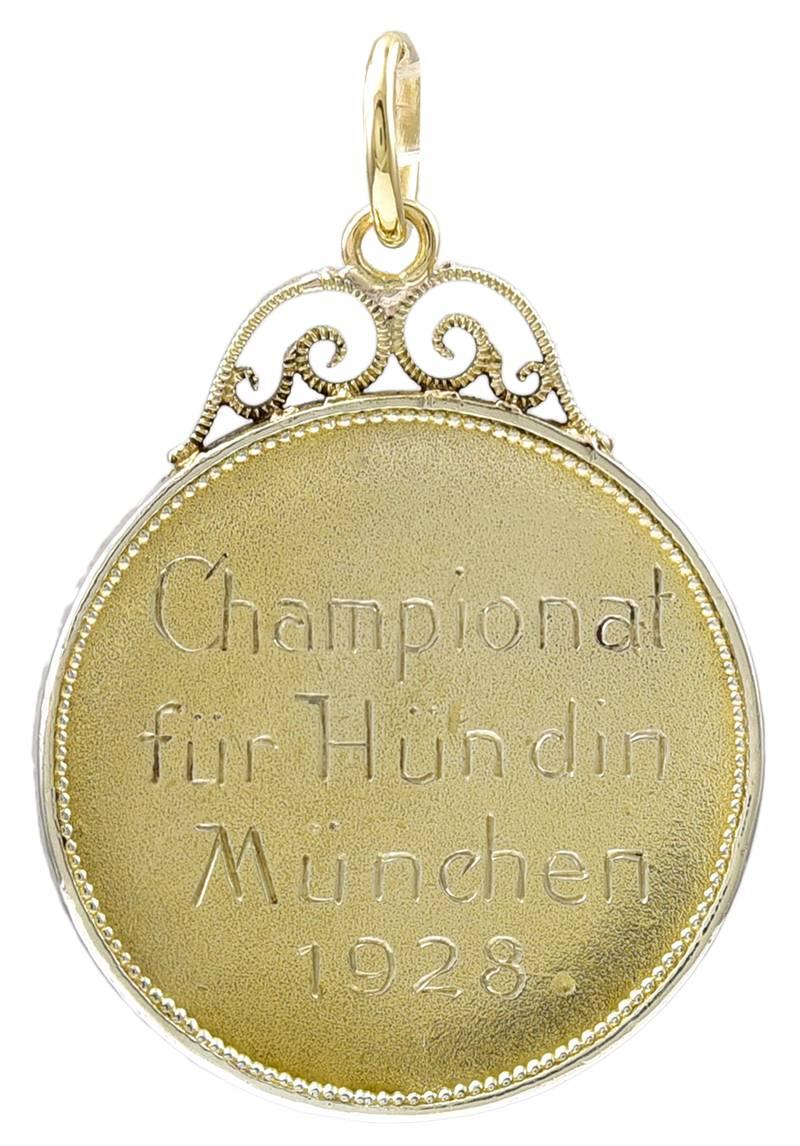 Antique charm/pendant.  In the center is a well-detailed bulldog head.  Applied letters around the border spell out "Continentaler Bulldog Club 1904."  The medal was awarded in 1928 and engraved:  "Champional Fur Hundin Munchen."