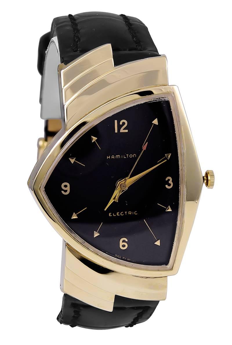 Asymmetrical "Ventura" pattern wrist watch.  Made and signed by HAMILTON.  14K yellow gold.  On a deep chocolate brown embossed leather band.   A bold, distinctive timepiece.

Alice Kwartler has sold the finest antique gold and diamond