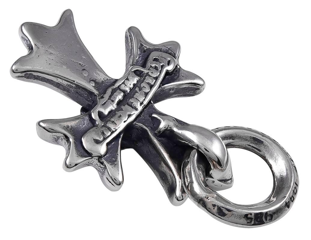 Extra-heavy gauge sterling silver figural "Maltese Cross."  Made and signed by CHROME HEARTS.  1 1/2" x 3/4."  Very distinctive and attractive.  

Alice Kwartler has sold the finest antique gold and diamond jewelry and silver for