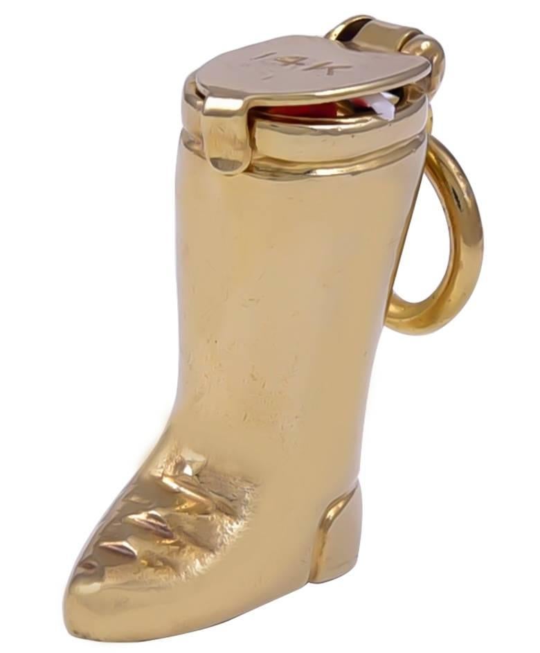 Figural "Santa's Boot" charm.  14K yellow gold.  Open the hinge and Santa's head pops out, wearing a red and white hat.  Adorable.  2/3" long.

Alice Kwartler has sold the finest antique gold and diamond jewelry and silver for over