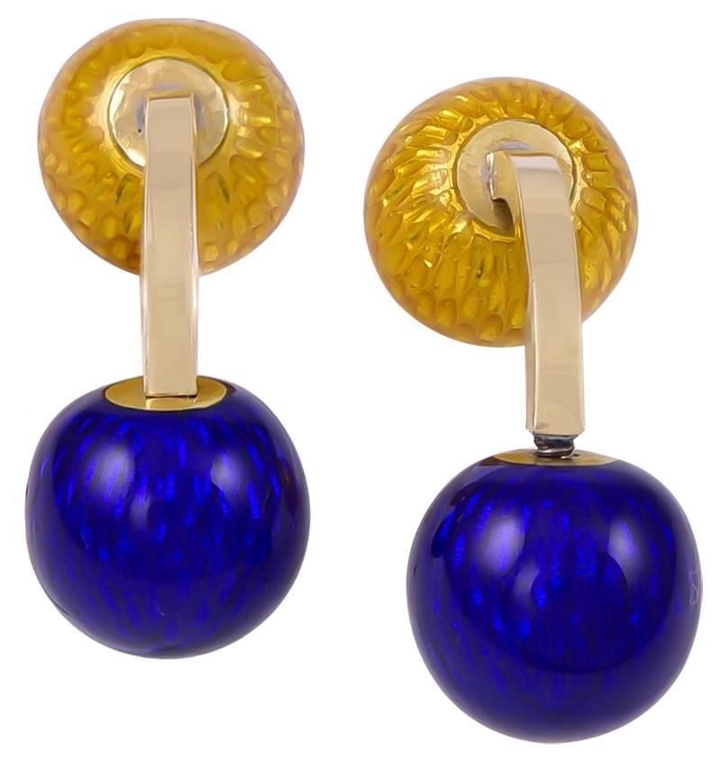 Striking and easy to wear barbell cufflinks.  Made and signed by TIFFANY & CO.  18K yellow gold, with cobalt blue and 'textured" yellow enamel.  The connector bar is solid, so the cufflinks are easy to put on.  Excellent color