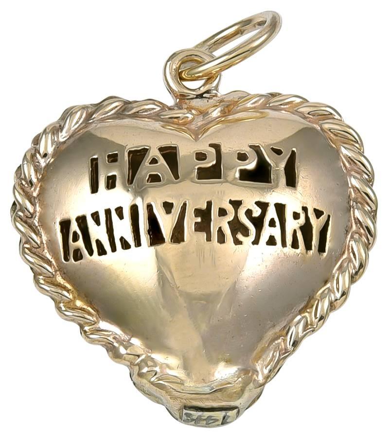 Wonderful figural puffed "heart."  Cut-out letters spell out "HAPPY ANNIVERSARY."  14K solid gauge shiny gold.  Applied rope border.  7/8" x 7/8."  Chunky.  A memorable way to mark a special anniversary.  

Alice