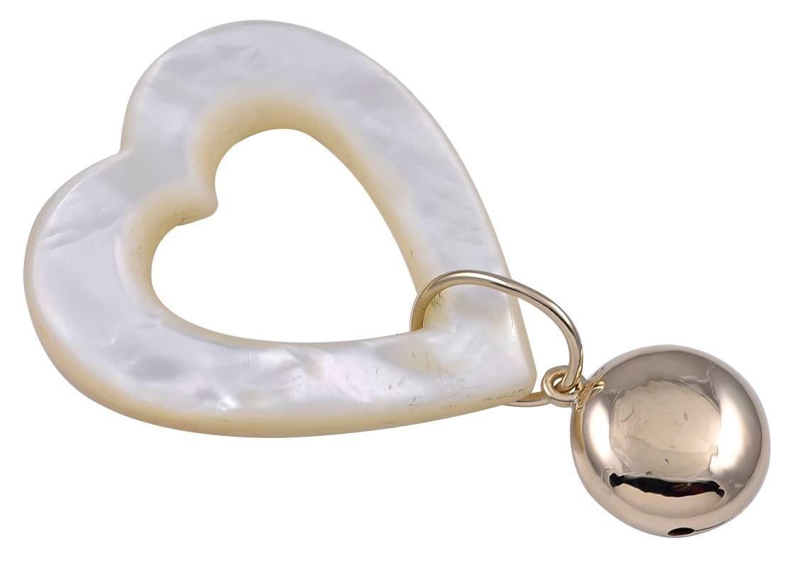 The perfect baby rattle:  figural "heart" mother-of-pearl, suspending a 14K yellow gold rattle.  Made by BLACK STARR & FROST.  2" x 2"  For a very special, much-loved baby.

Alice Kwartler has sold the finest antique gold and