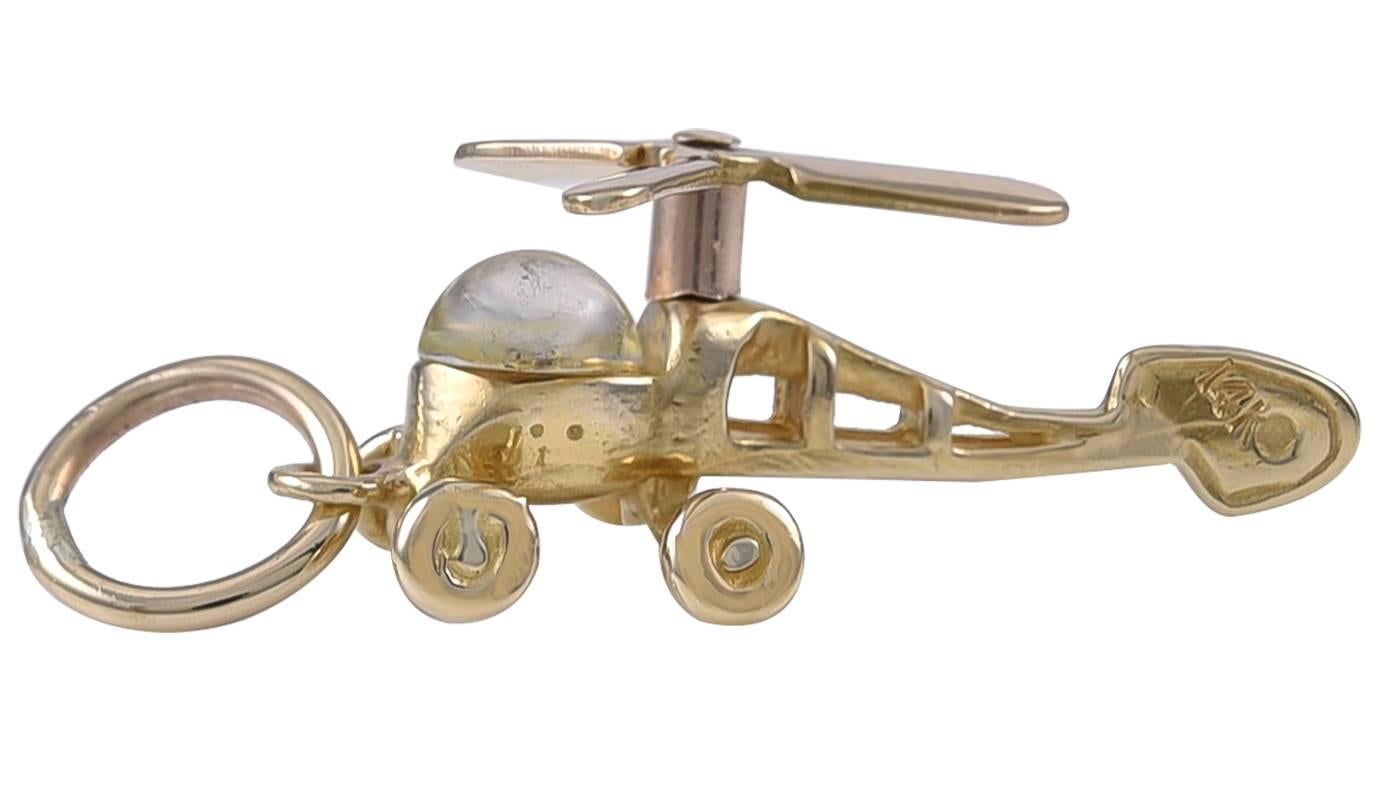 Rare figural "helicopter" charm.  14K yellow gold, with a crystal cockpit.  The blade is moveable and spins around.  1" x 1/3."  A very unusual subject.

Alice Kwartler has sold the finest antique gold and diamond jewelry and