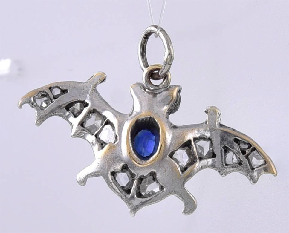 A fabulous antique find:  a figural "bat" with diamond wings, a faceted sapphire body and cabochon ruby eyes.  Set in platinum.  3/4" x 1/2."  We've never seen one before.

Alice Kwartler has sold the finest antique gold and