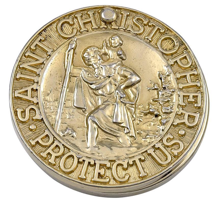 St. Christopher's medal in high relief.  Slides open to reveal a locket, with original bezel.  1 1/4" in diameter.  Gilt metal.  A personal memento, especially for one who travels.

Alice Kwartler has sold the finest antique gold and diamond