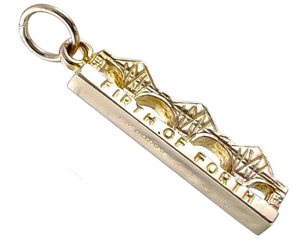 Gold charm, depicting a bridge, with the engraving 