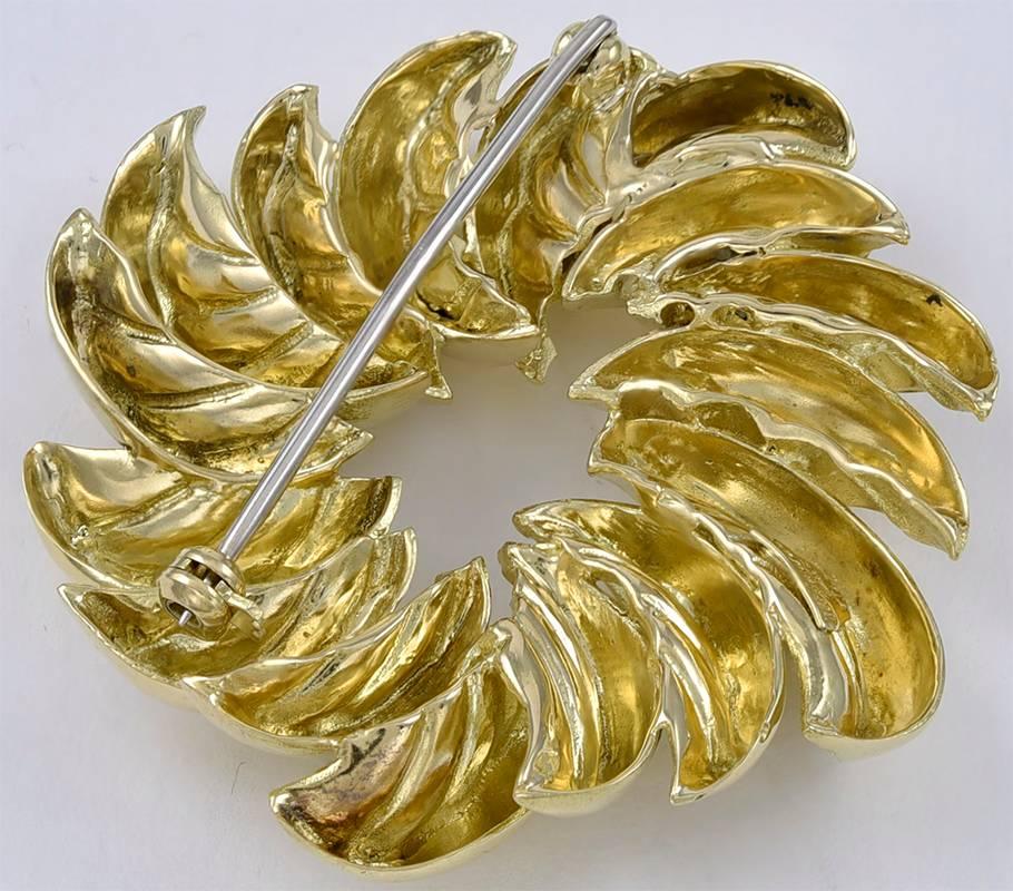 Statement 18K gold brooch.  Made and signed by TIFFANY & CO.  The outsides of the leaves are shiny gold; the insides are matte, creating an interesting textured appearance.  2" in diameter.  Heavy gauge gold.  

Alice Kwartler has sold the