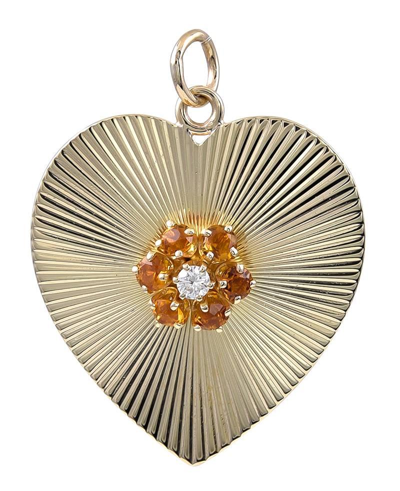 Lovely large heart-shaped pendant/charm.  Made and signed by TIFFANY.  14K yellow gold with allover diagonal line pattern.  The center has a brilliant applied cluster of six faceted citrines and a diamond.  1 1/3
