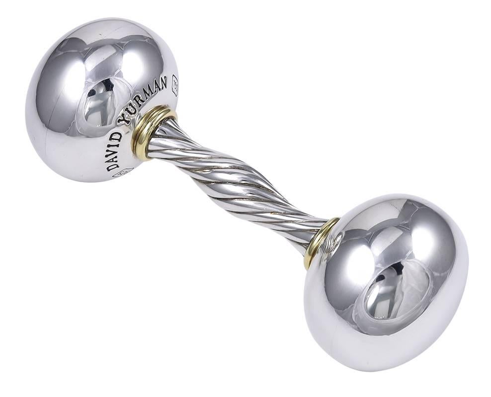 Large barbell baby rattle.  Made and signed by DAVID YURMAN.  Sterling silver with two 18K yellow gold applied bands.  4 1/2