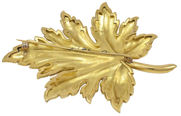 Large beautiful figural leaf pin, in 18k  yellow gold, made and signed by Tiffany & Co. The fine detailed engraving shimmers in the light. This is an outstanding and important large pin, 3 inches long. Very impressive on a lapel or LBD.
A luxurious