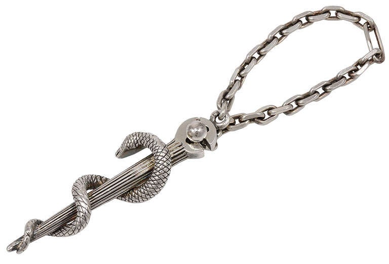Unusual sterling silver key chain with figural caduceus, made by Tiffany Paris.
Very graceful and well detailed. A great gift for a doctor.
