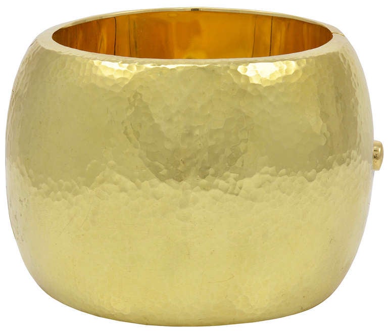 Most impressive hand-hammered wide bangle in 18K gold by Paloma Picasso.
Made for Tiffany & Co in 1988.This is a bangle on a grand scale. Over 2 inches wide and very heavy. This is a statement bracelet. Bold and beautiful.