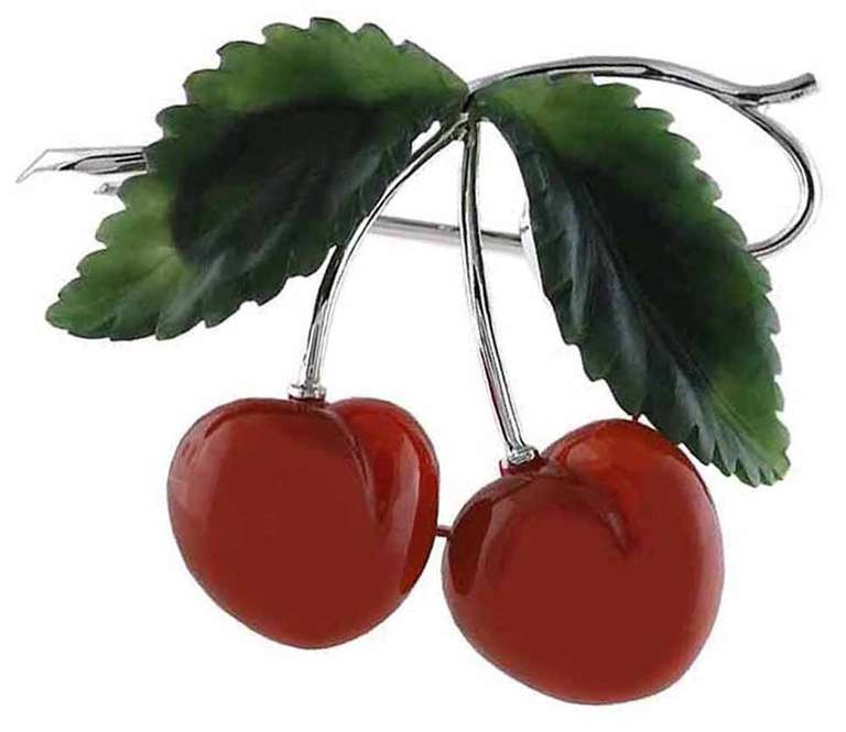Figural carnelian cherry brooch with carved jade leaves set in 14k white gold.
Beautifully made. A most  graceful and appealing piece of jewelry.