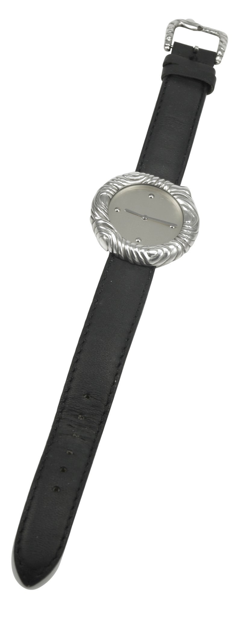 Sterling silver watch with heavily embossed border and buckle. Made and signed by Angela Cummings.1 1/3