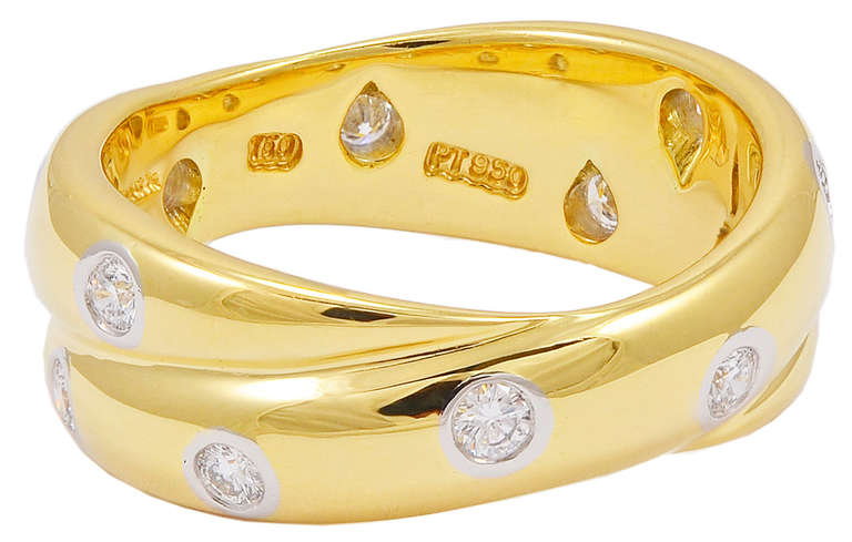 Very fashionable 18K gold  ring set with 5 diamonds in each band. 
Easy to wear alone or in conjunction with other rings to stack. Size 51/2
A great look.