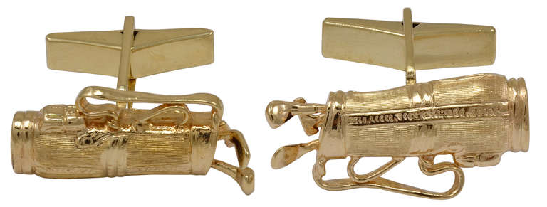 Figural cufflinks, golf clubs inside golf bag. Set in 14K gold. Shiny gold clubs contrast with textured gold bag. Good size 1 1/8