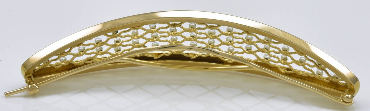 Large graceful barrette in 14k gold. Engraved leaf pattern around border.  Delicate fine open lattice-work pattern, set with seed pearls.  4