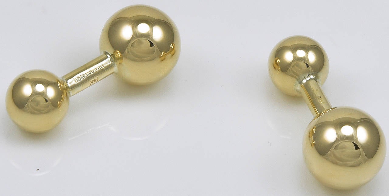 Classic gold barbell cufflinks.  Made and signed by TIFFANY & CO.  14K yellow gold, from the 1940's.  A polished look, easy to put on.
Alice Kwartler has sold the finest antique gold and diamond jewelry and silver for over 40 years.