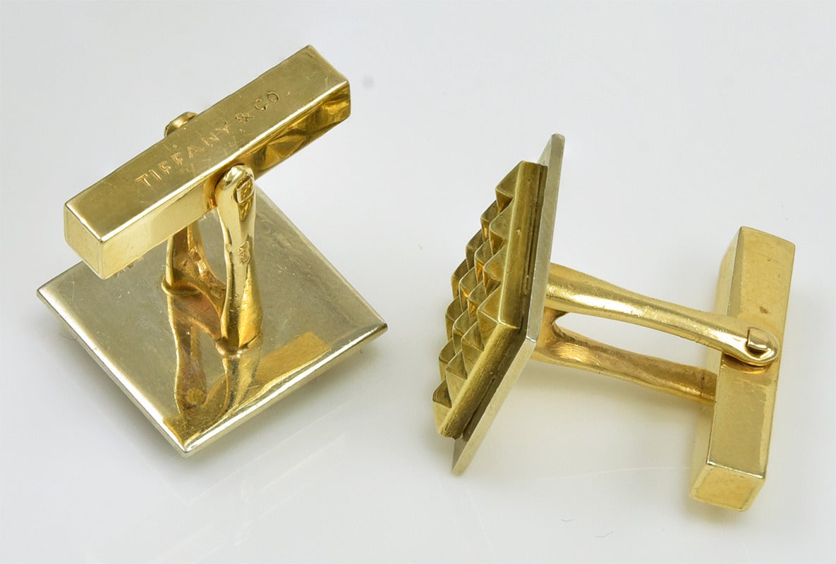 Bold square cufflinks.  Made and signed by Tiffany & Co. Applied geometric pattern, set in relief.  14k yellow gold.  Strong and masculine.

Alice Kwartler has sold the finest antique gold and diamond jewelry and silver for over 40 years.