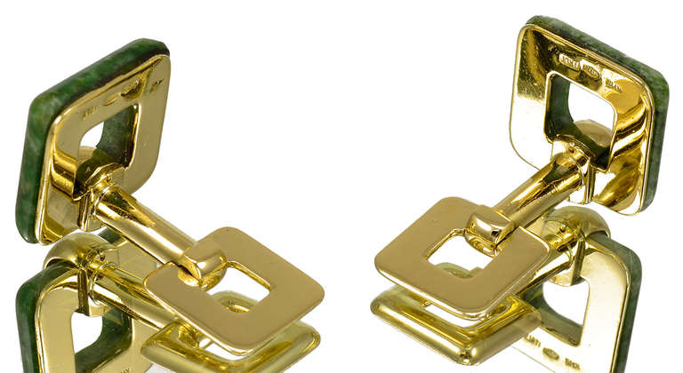 Large flip-up cufflinks. 18k yellow gold and nephrite. Bold square shape. 
Easy to wear and most attractive.