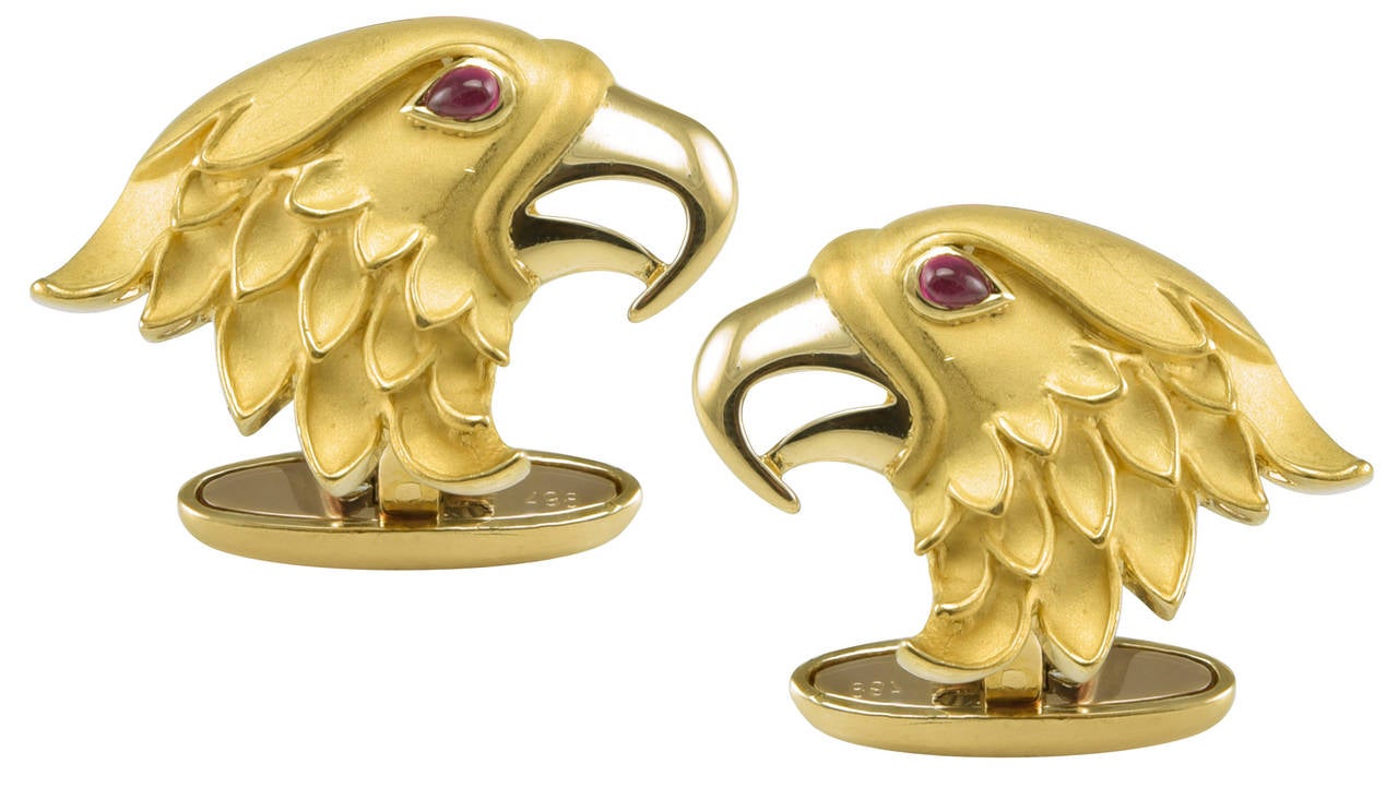 Bold striking figural eagle head cufflinks. Made and signed by Carrera y Carrera.
18K matte and shiny yellow gold with cabochon ruby eyes, A strong masculine look.

Alice Kwartler has sold the finest antique gold and diamond jewelry and silver