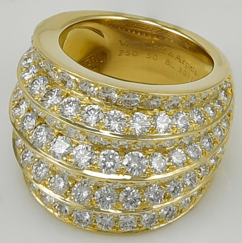 Exceptional extra-wide diamond band. Made, signed and numbered by Van Cleef & Arpels. Known as the 